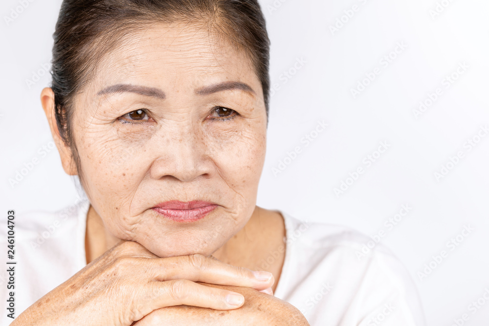 Fototapeta premium Old wrinkled asian woman thinking with copy space