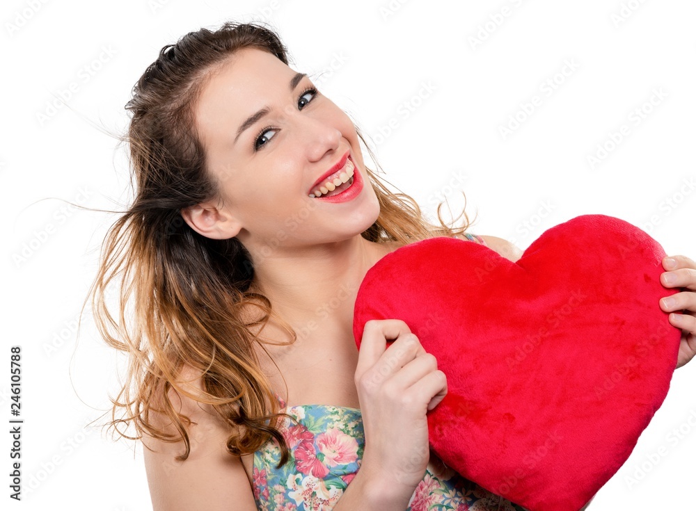 pretty smiling young woman with a red heart on white pretty smiling young woman with a red heart on white