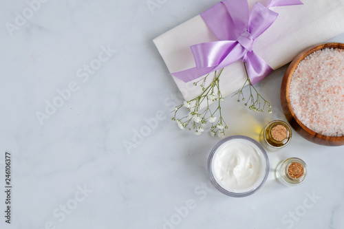 Spa natural skin care products, cosmetic products - cream, oil and soap, salt - creative layout on white background