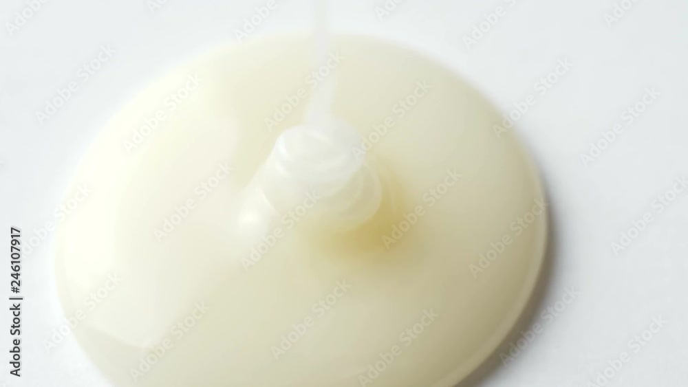 Pouring liquid White Honey Dripping on White Surface Close Up Macro. 4k Footage. Pouring liquid White Honey Dripping on White Surface Close Up Macro. 4k Footage.