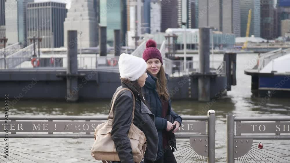 Two girls on a sightseeing tour to New York City at Hudson River Two girls on a sightseeing tour to New York City at Hudson River