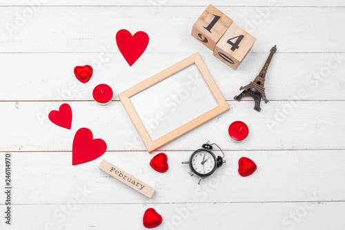 Creative Valentine Day romantic composition flat lay top view love holiday celebration red heart calendar date white wooden background