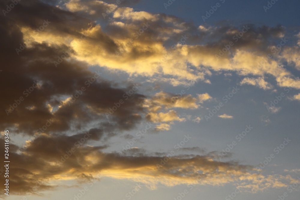 marvellous vivid sun colored clouds in the sky for using in design as background.