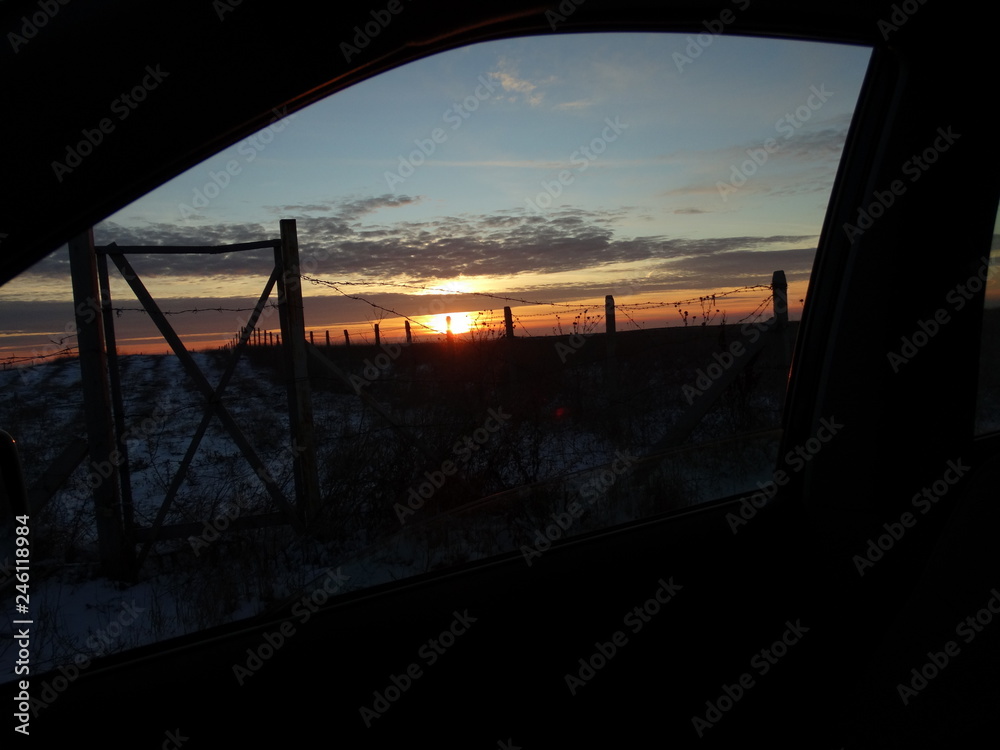 Dramatic Sunrise Sky View through Car Window