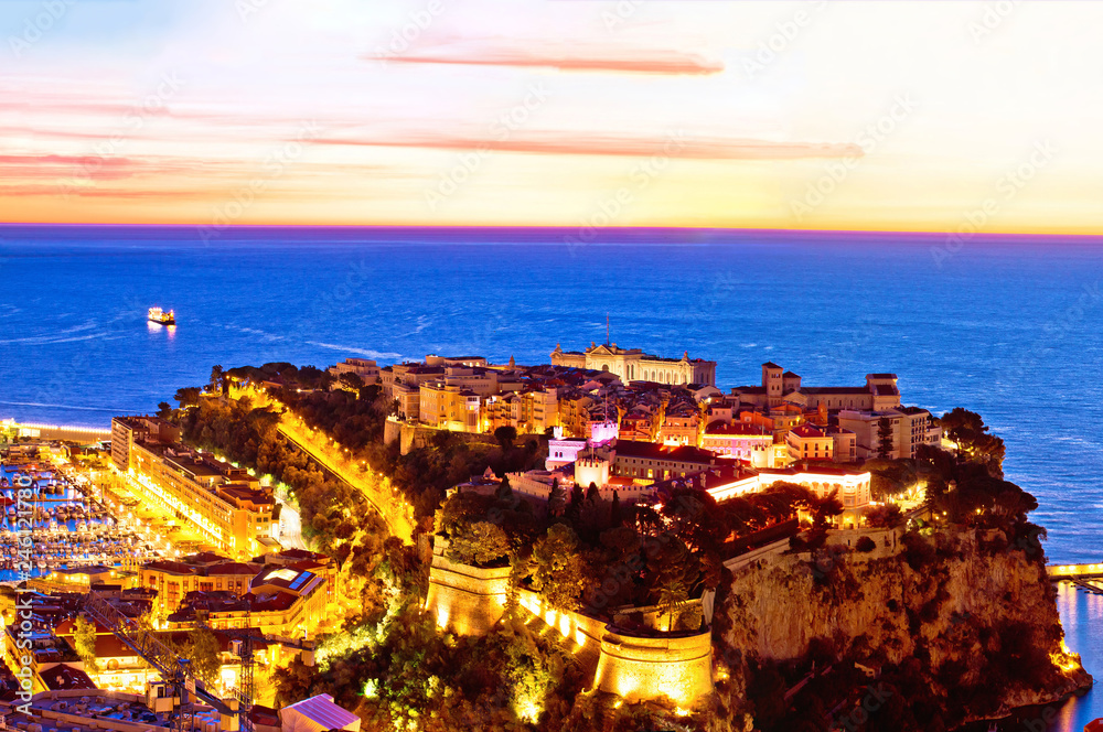 Old Monaco town on the rock colorful evening panoramic view from above