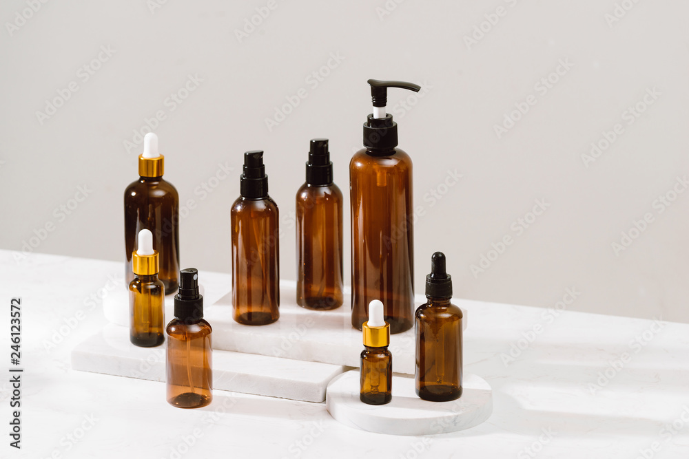 Set of empty brown transparent spray bottles Set of empty brown transparent spray bottles