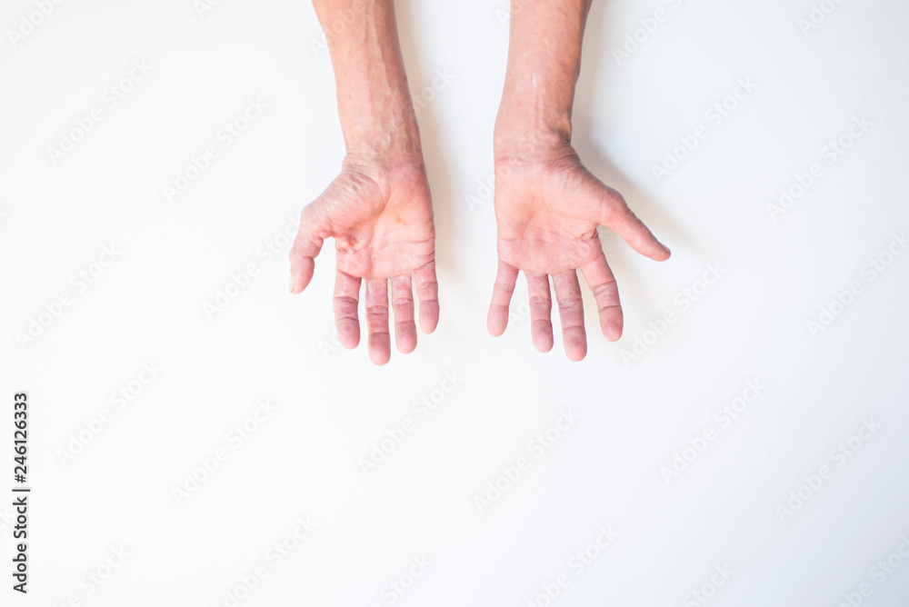 Both palms and fingers of the elderly man on a white background Both palms and fingers of the elderly man on a white background