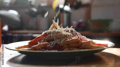 Wallpaper Mural Sprinkle pasta with grated cheese in slow motion Torontodigital.ca