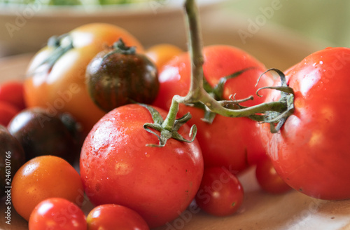 Fresh types of organic tomatoes in a kitchen