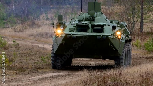 Military exercises in the open area with the use of armored vehicles, tanks and assault forces.