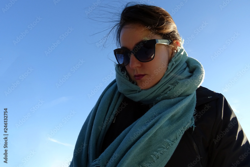 Female in Winter Clothes isolated on Sky Background Female in Winter Clothes isolated on Sky Background