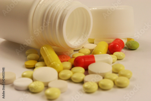 Pharmaceutical medicament, cure in container for health on white background.