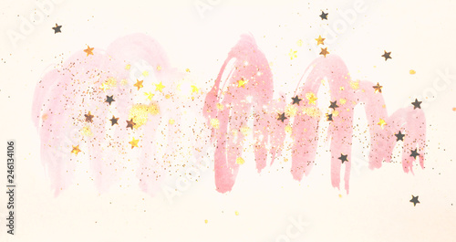 Golden glitter and glittering stars on abstract pink watercolor splashes in vintage nostalgic colors.