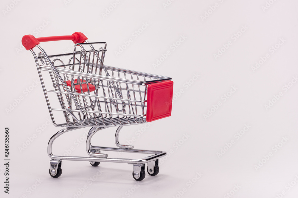 An empty grocery cart with expansion shelf on white background An empty grocery cart with expansion shelf on white background