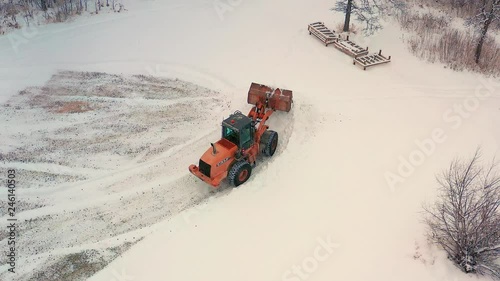 Piling up snow with a front end loader photo