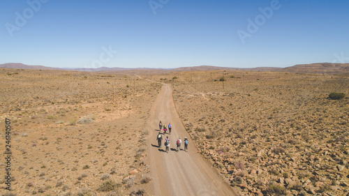 Photography Aerial image of a group of hikers doing a hiking train in the karoo region of so