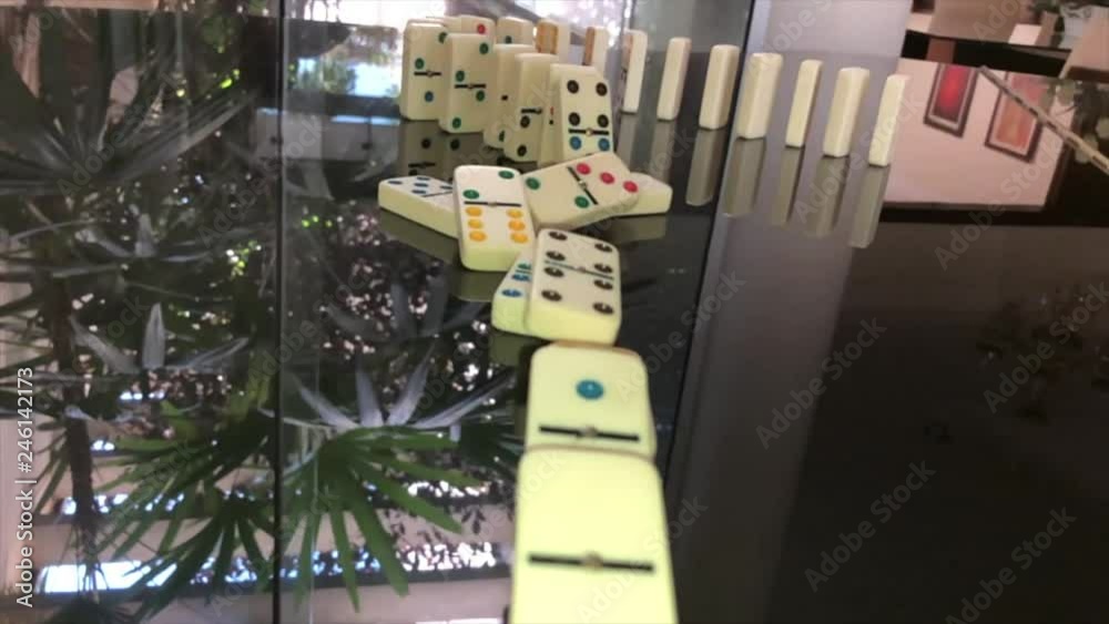 Domino Effect on a reflecting piano surface