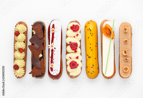 Fotografia Group of french dessert Eclair on white background, top view