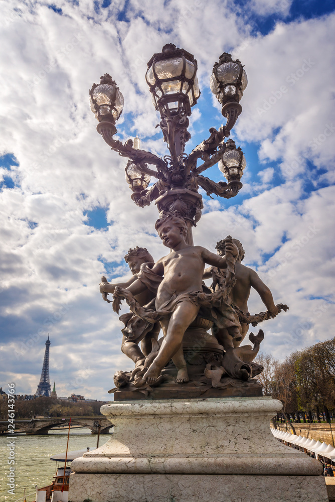 Fototapeta premium Street lamp from year 1900 on bridge Alexandre III, the river Seine and the Eiffel tower, Paris, France