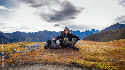 Young hiker resting in Tombstone Park in Yukon Canada
