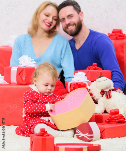 What to expect. Valentines day. Red boxes. Happy family with present box. shopping. Boxing day. Love and trust in family. Bearded man and woman with little girl. father, mother and doughter child