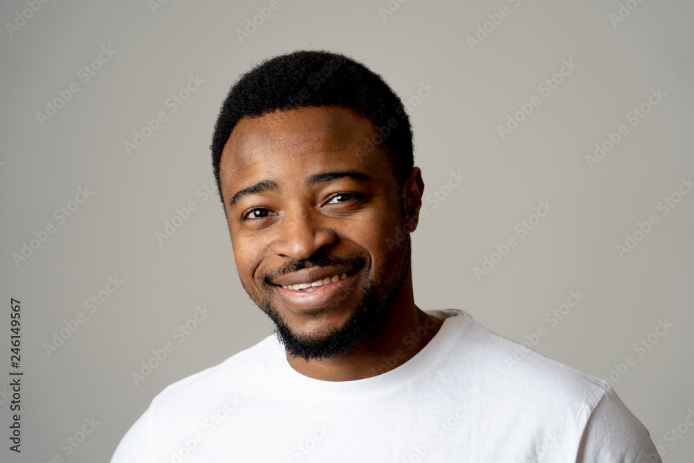 Close up portrait of smiling and laughing attractive man in happy face human emotion and expression