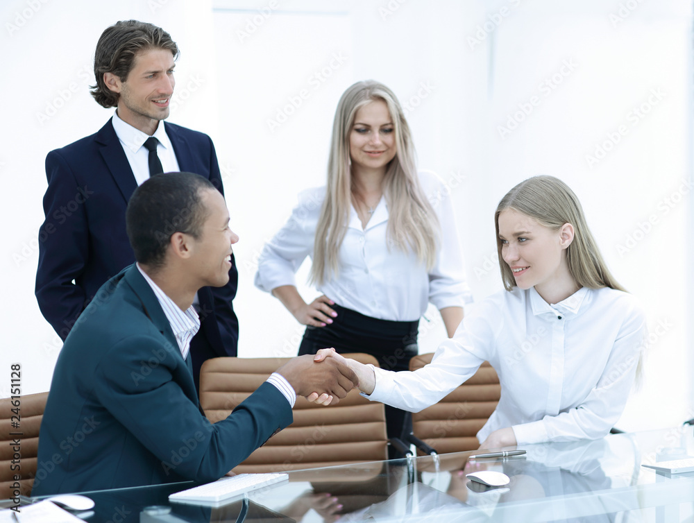 handshake Manager and the client in the office handshake Manager and the client in the office