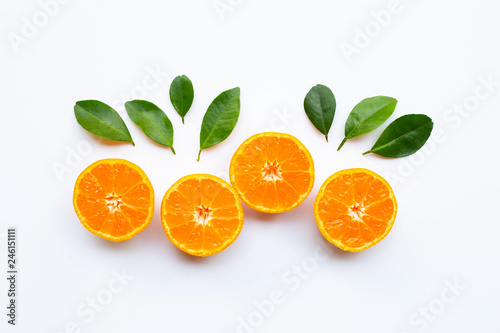 Orange fruits with  leaves on white background.