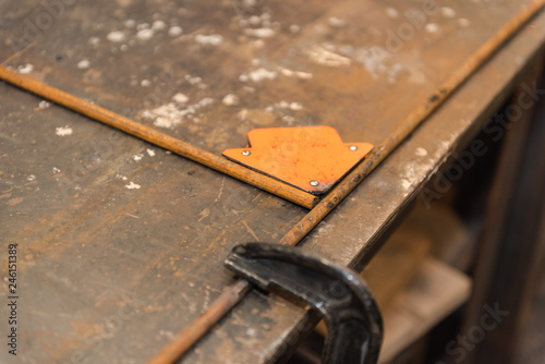 Work with welding in the carpentry shop. Weld metal parts. Dangerous industry