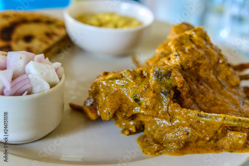 Mutton in spicy gravy served with parantha (Indian Bread) & Boondi Raita photo