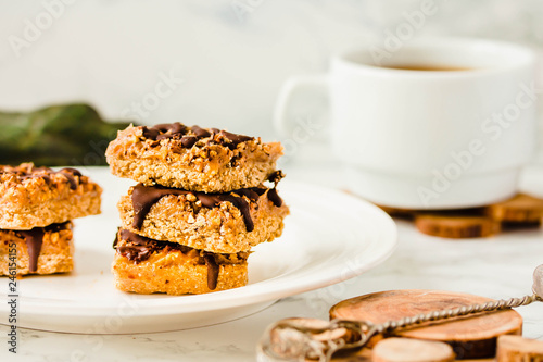 Organic Chocolate Cake Slices with a cup of coffee on a white stone background. Plant based diet dessert.