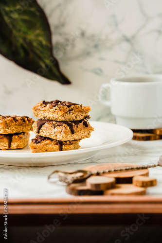 Organic Muesli and Dried fruit bars. Healthy breakfast and snack. White table background.Selective focus