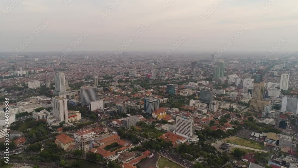 Aerial cityscape modern city Surabaya with skyscrapers, buildings and houses. sunset in city skyline with skyscrapers and business centers Surabaya capital city east java, indonesia Aerial cityscape modern city Surabaya with skyscrapers, buildings and houses. sunset in city skyline with skyscrapers and business centers Surabaya capital city east java, indonesia