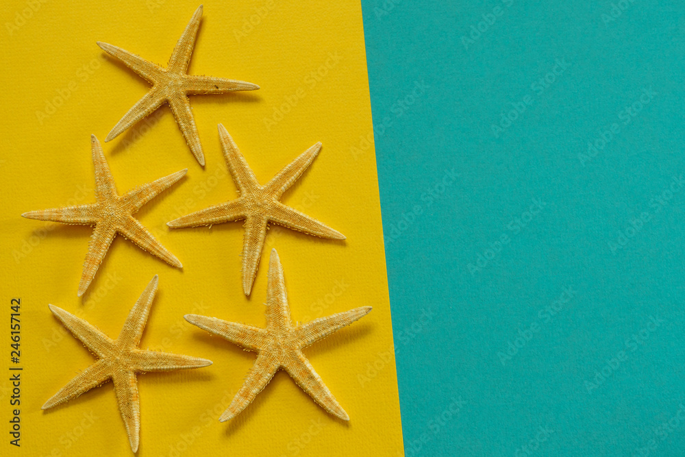 Summer background of yellow and blue paper with starfish, symbol Summer background of yellow and blue paper with starfish, symbol