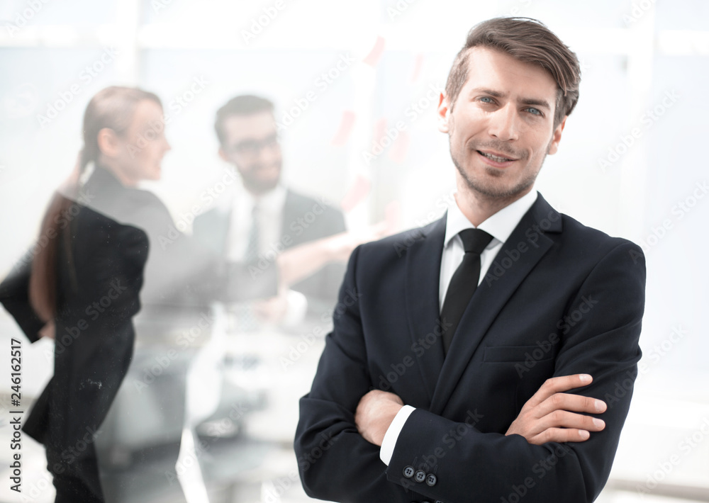 successful businessman standing in a modern office successful businessman standing in a modern office