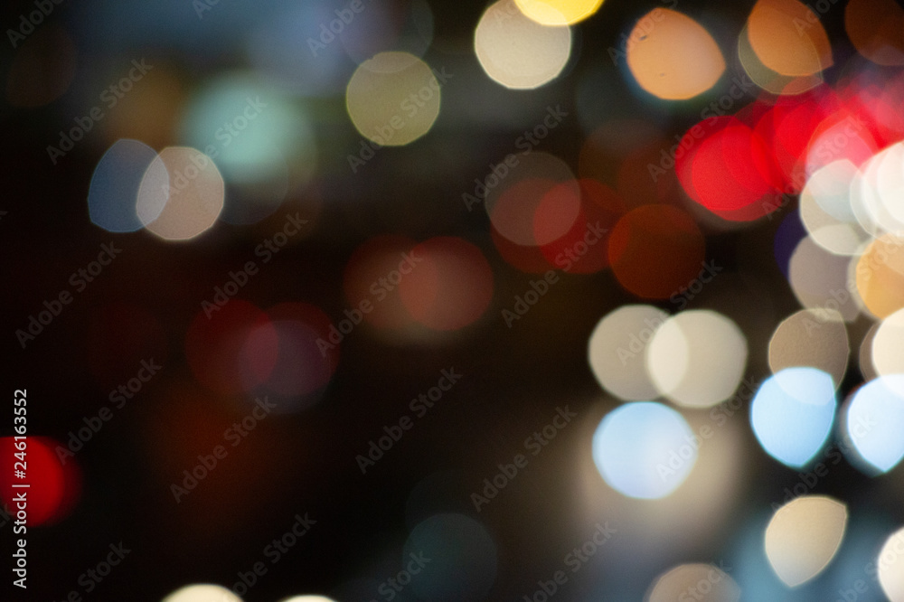 Fototapeta premium Bokeh night light on the avenue Light night at city blue bokeh sky festival abstract background blur lens flare reflection beautiful circle street with dark