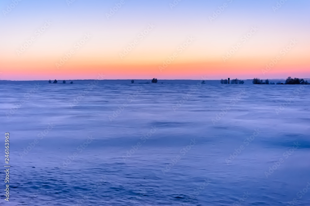 Sunrise in winter in the field