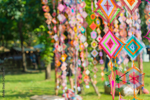 Spider web flag colorful of local Thai traditional merit old style for protect is widespread decorate flags in religion events in the North East Thailand  Abstract blurred and soft focus