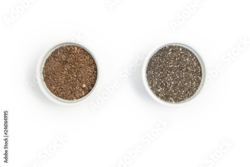 Small bowl with chia seeds and flax seeds with equal sign seen directly from above on grey background