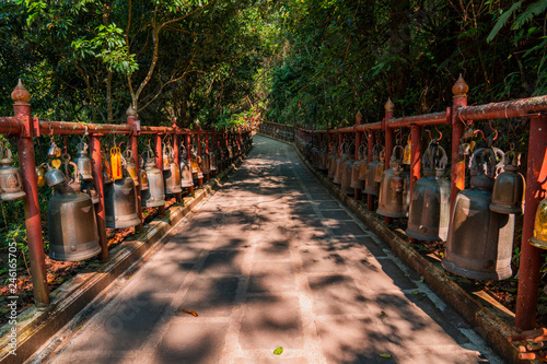 Bells bridge in Thai buddhist temple in Chiang Rai