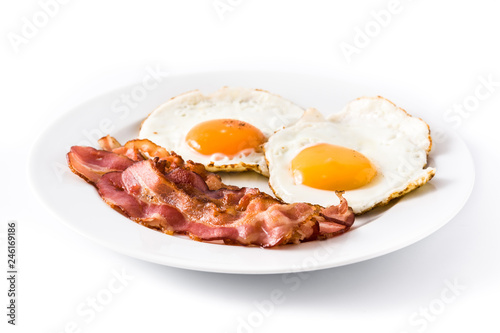 Fried eggs and bacon for breakfast isolated on white background. Close up