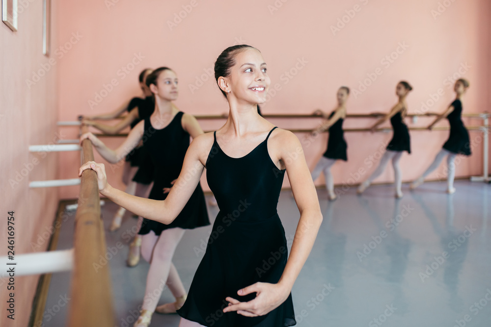 Obraz premium The group of beautiful teenage girls practicing ballet dance.