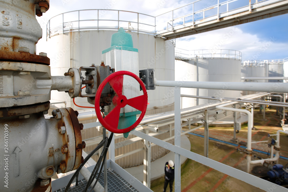 Oil and gas refinery petroleum plant pipe valve and oil tanks Stock
