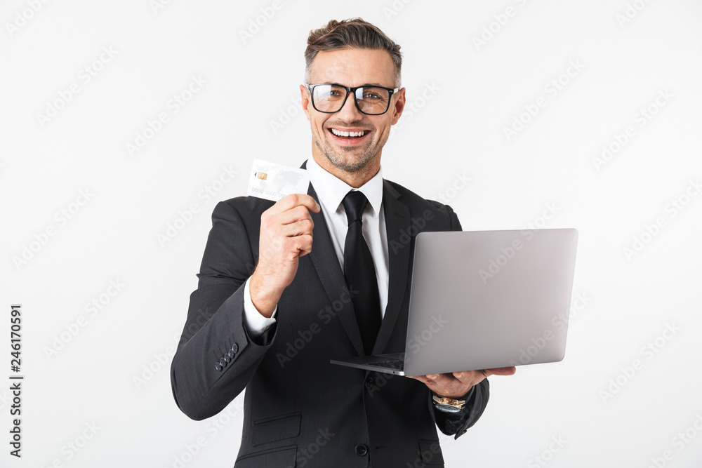 Handsome business man isolated over white wall background using laptop computer. Handsome business man isolated over white wall background using laptop computer.