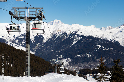 Cable car on the ski resort in France. Beautiful winter landscape and snow covered mountains