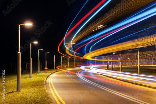 light trails of car on road at night. Traffic background photo