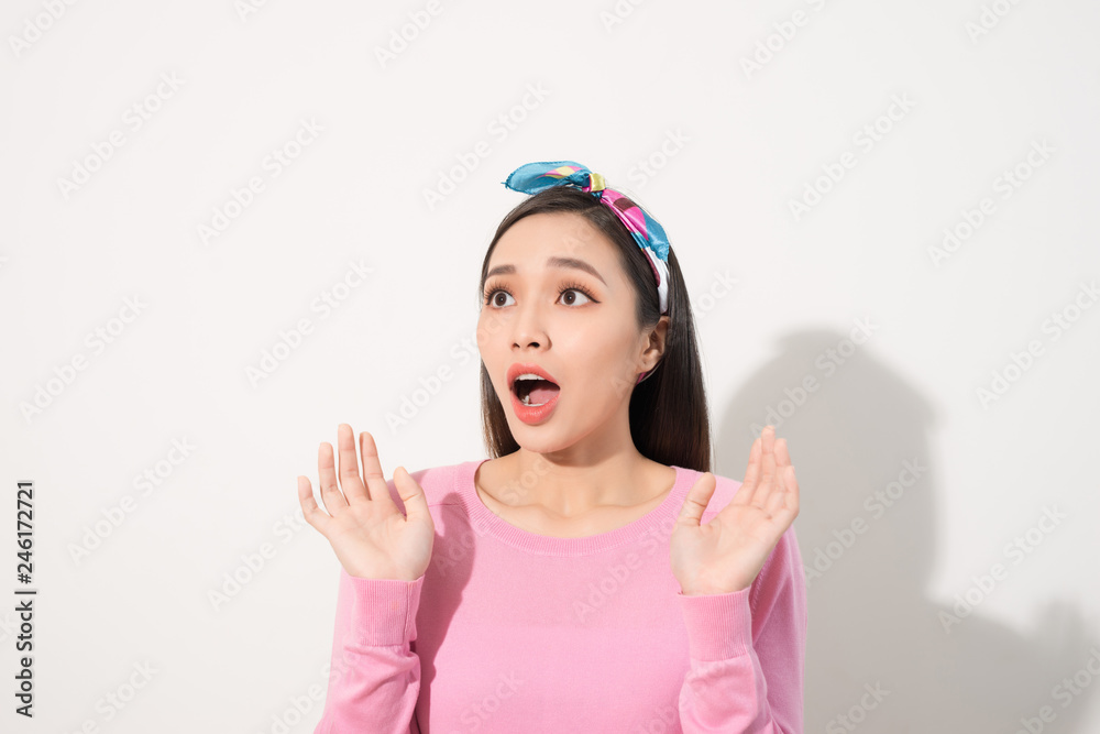 Asian Young Woman in Surprising Emotion, Face Look up above with opened mouth and hands, Emotional of Female Concept, Front view Asian Young Woman in Surprising Emotion, Face Look up above with opened mouth and hands, Emotional of Female Concept, Front view