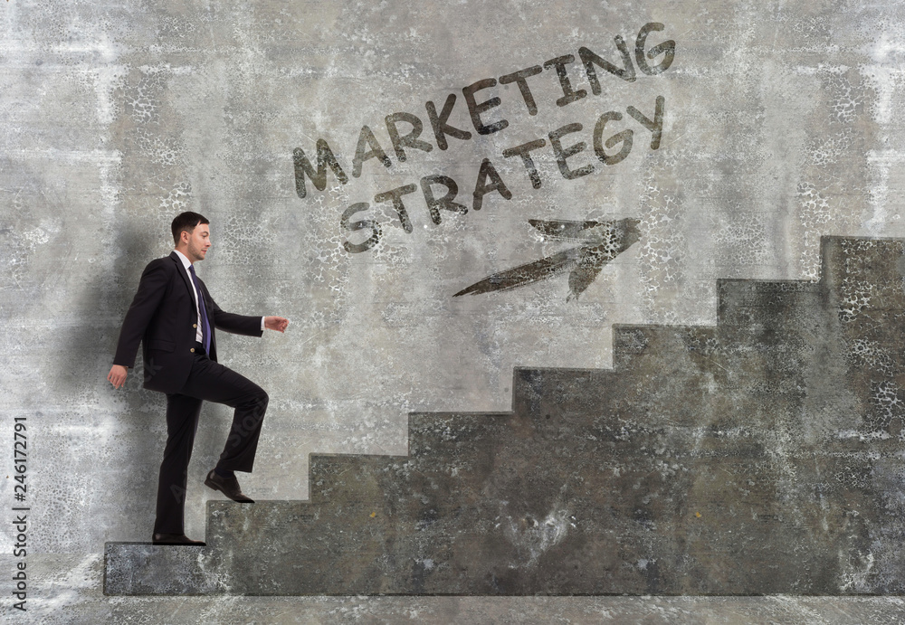 Business, technology, internet and networking concept. A young entrepreneur goes up the career ladder: marketing strategy Business, technology, internet and networking concept. A young entrepreneur goes up the career ladder: marketing strategy