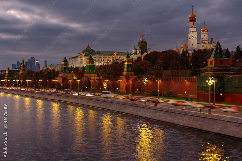 View of Kremlevskaya embankment and Moscow Kremlin on a cloudy evening