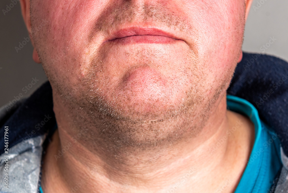 Bristles on the beard of a man on grey background.